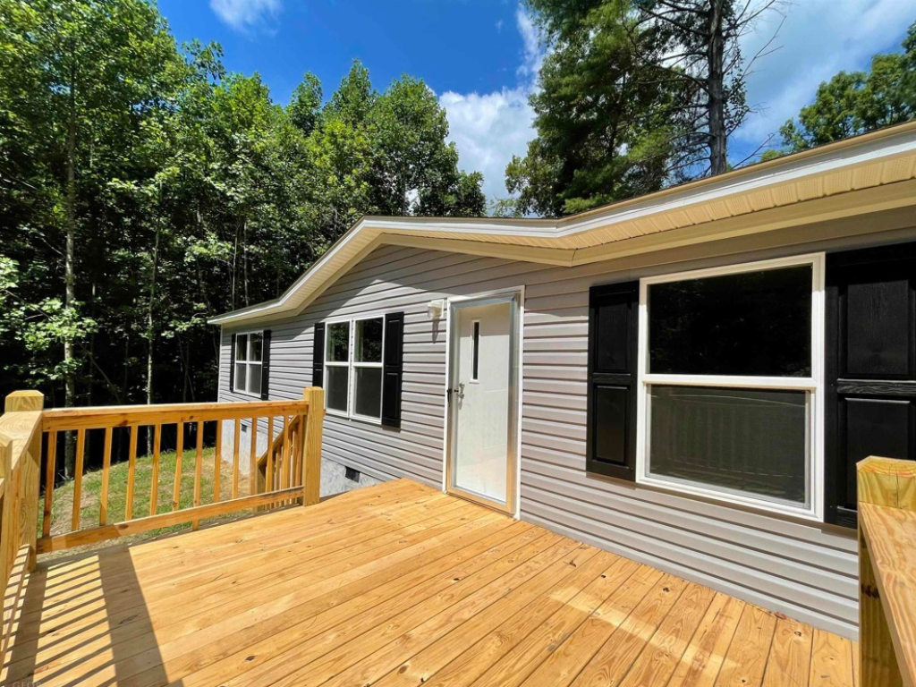 a gray residential home with wooden flooring